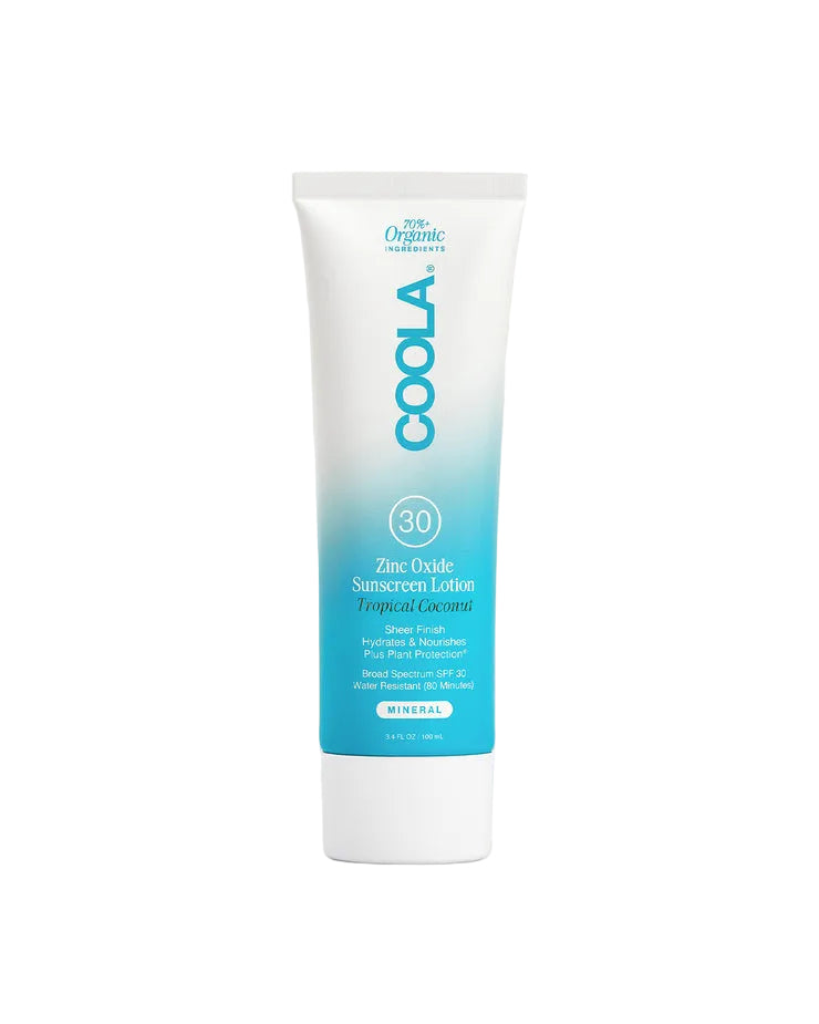 Coola sunscreen lotion tube on a light gray background